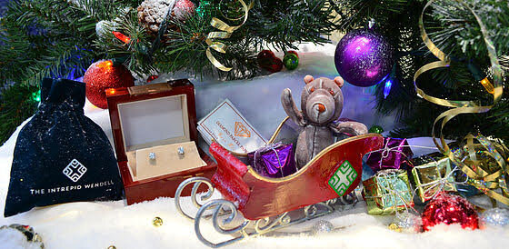 Our Christmas card with Wendell in sleigh, with jewelry and gifts gathered around. He is waving to us.